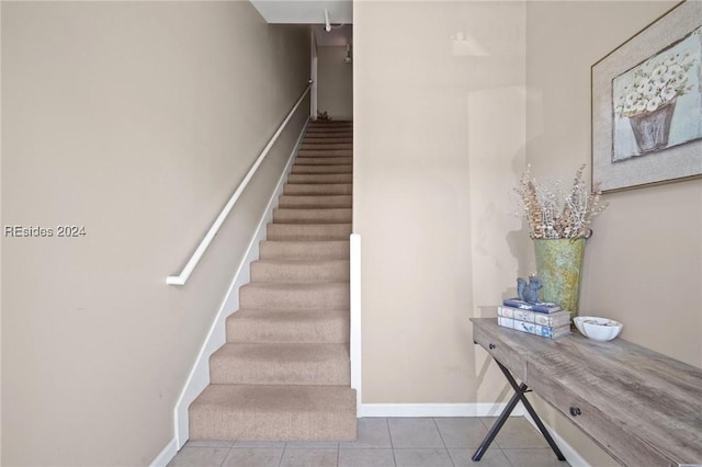 stairway featuring tile patterned floors