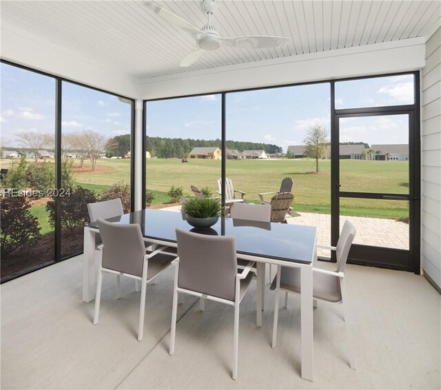 sunroom / solarium with wooden ceiling and ceiling fan