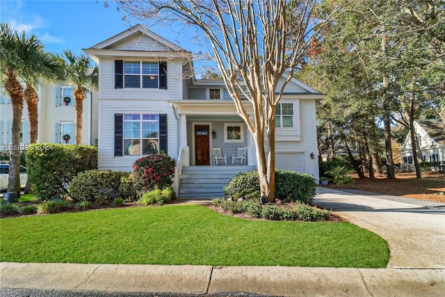 view of front of house featuring a garage and a front yard