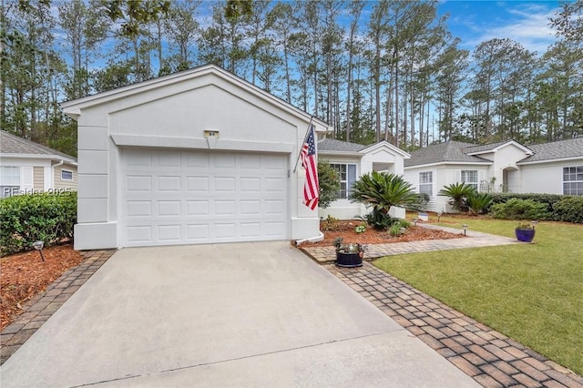 ranch-style house with a garage and a front yard