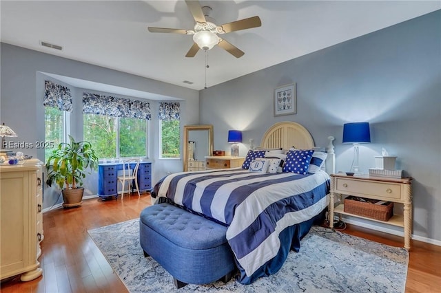 bedroom featuring hardwood / wood-style flooring and ceiling fan