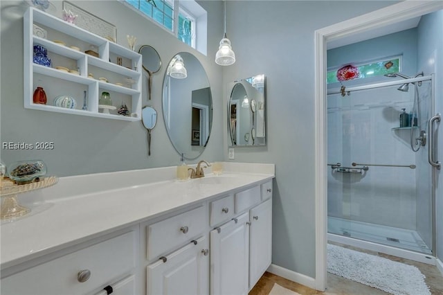 bathroom featuring vanity, tile patterned floors, and walk in shower