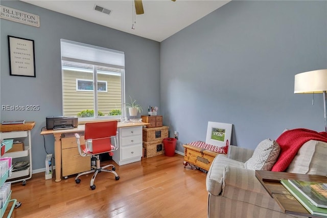 office area with ceiling fan and light hardwood / wood-style floors