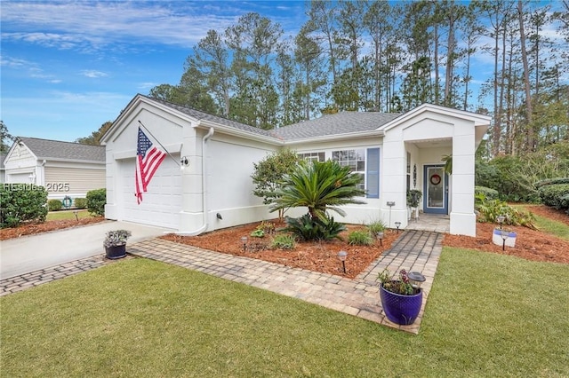 single story home featuring a garage and a front yard