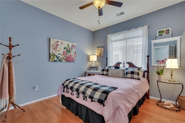 bedroom with light hardwood / wood-style floors and ceiling fan