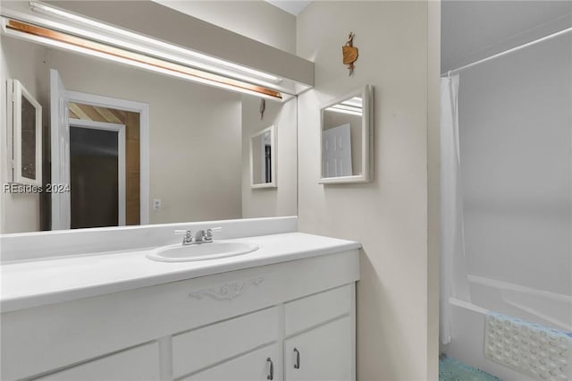 bathroom featuring vanity and shower / bath combo with shower curtain