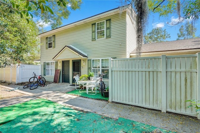 rear view of house with a patio area