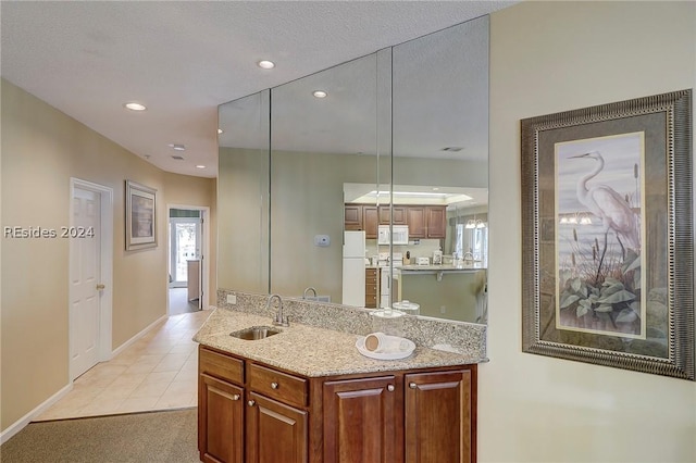 bathroom with vanity and tile patterned flooring