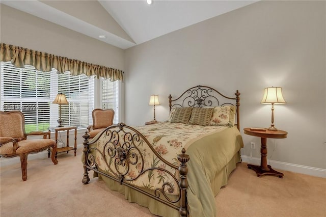 carpeted bedroom featuring high vaulted ceiling