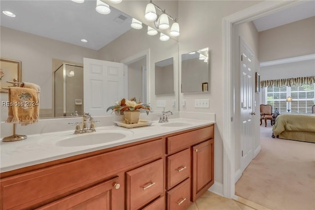 bathroom with vanity, tile patterned flooring, and a shower with shower door