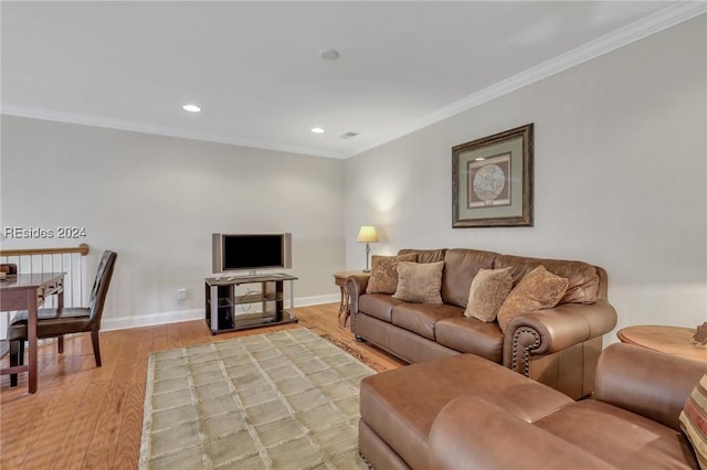 living room featuring crown molding and wood-type flooring