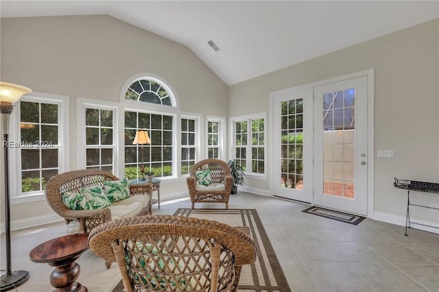 sunroom / solarium featuring lofted ceiling