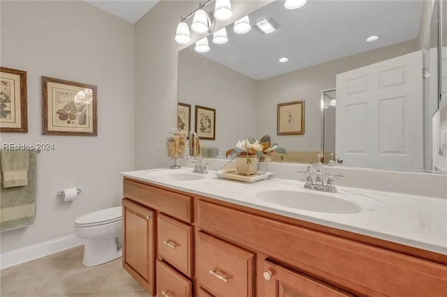 bathroom with vanity, tile patterned floors, and toilet