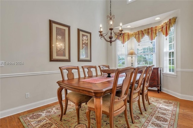 dining space featuring a chandelier and light hardwood / wood-style floors