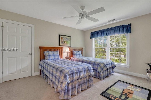 carpeted bedroom featuring ceiling fan