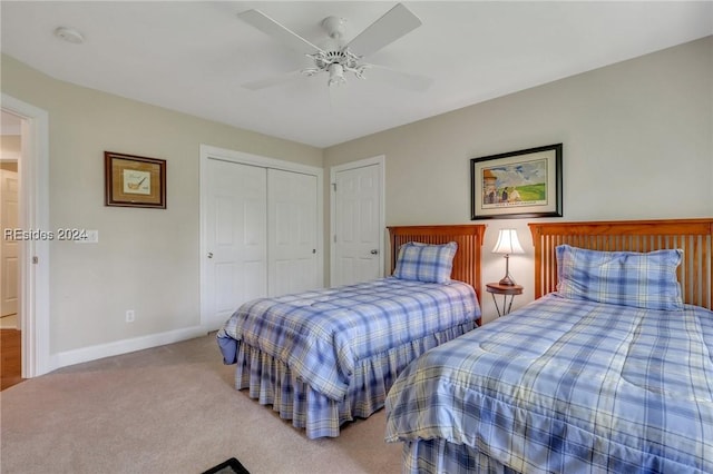 carpeted bedroom featuring ceiling fan and a closet