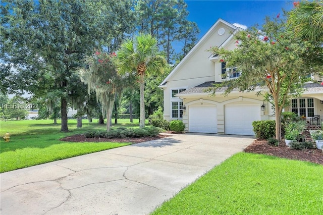 view of front facade featuring a garage and a front lawn