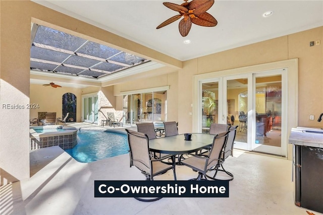 view of swimming pool with french doors and ceiling fan