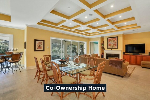 dining space featuring coffered ceiling, beam ceiling, crown molding, and a healthy amount of sunlight