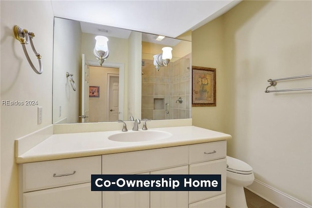 bathroom featuring toilet, vanity, tile patterned floors, and walk in shower