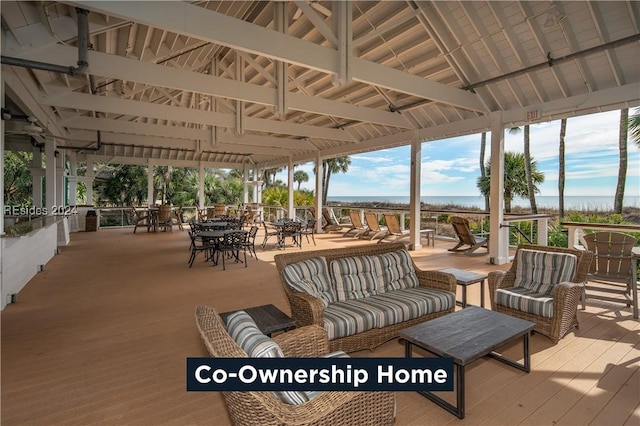 wooden terrace featuring an outdoor living space and a gazebo