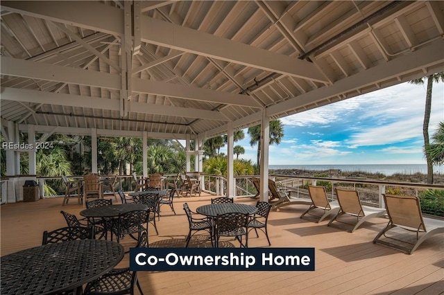 deck with a gazebo and a water view