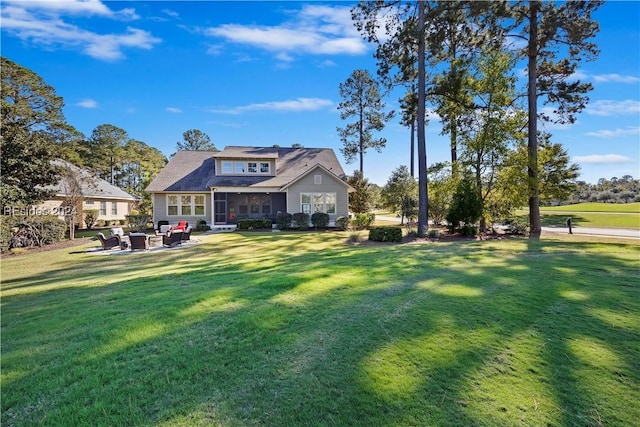 rear view of property featuring a yard and a patio