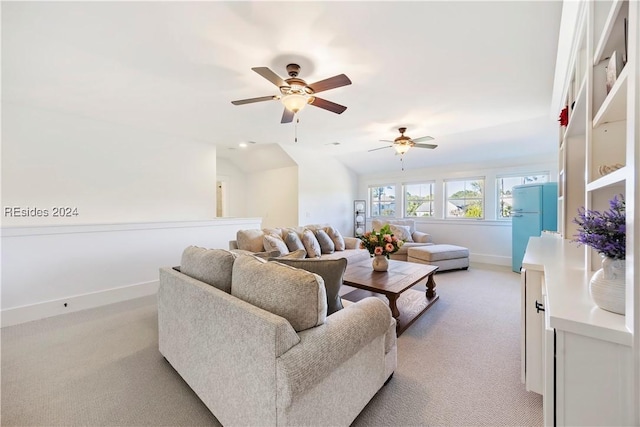 living room with light colored carpet and ceiling fan