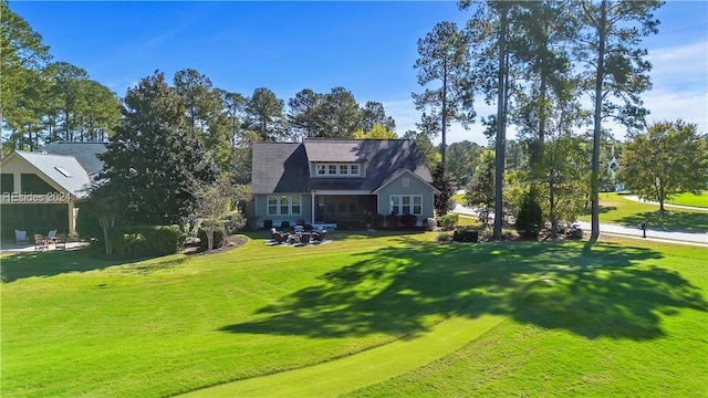 rear view of house with a lawn