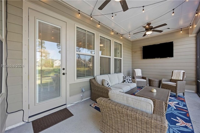 view of patio / terrace with an outdoor living space and ceiling fan