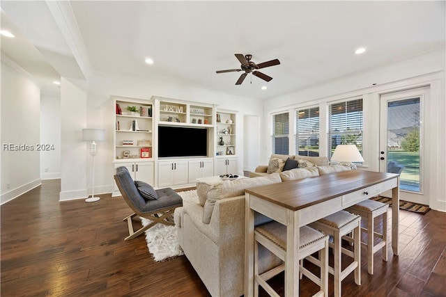 living room with dark hardwood / wood-style floors and ceiling fan