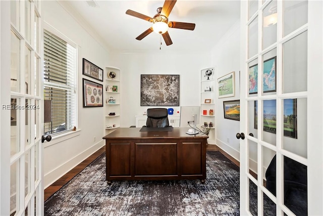 office with dark wood-type flooring, plenty of natural light, ornamental molding, and french doors