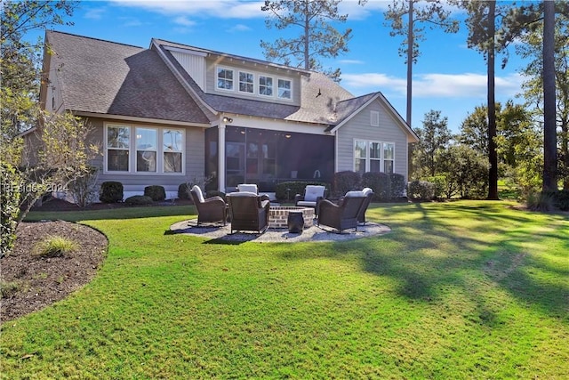 back of house with an outdoor living space with a fire pit, a patio area, and a lawn