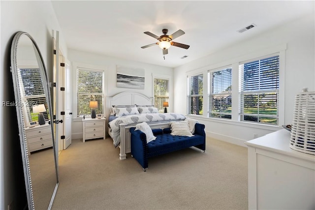 carpeted bedroom with ceiling fan