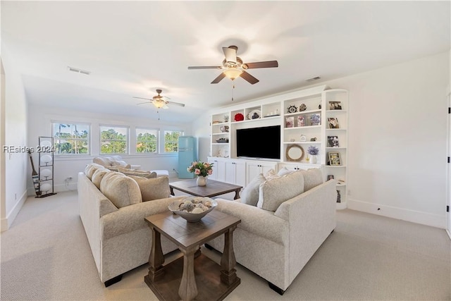 living room with vaulted ceiling, light carpet, and ceiling fan