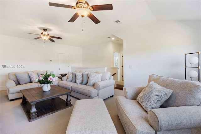 carpeted living room with vaulted ceiling