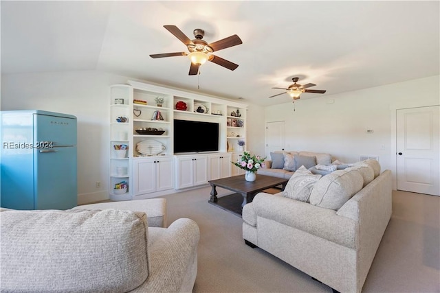 living room featuring ceiling fan, vaulted ceiling, and light carpet