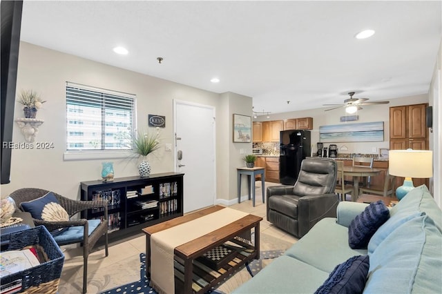 living room featuring ceiling fan and light tile patterned floors