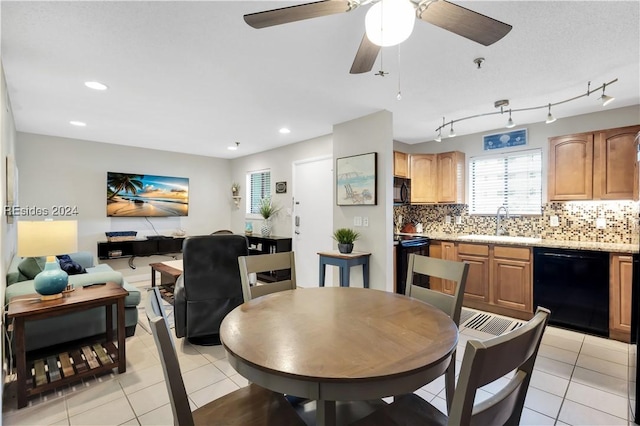 dining area with sink and light tile patterned floors