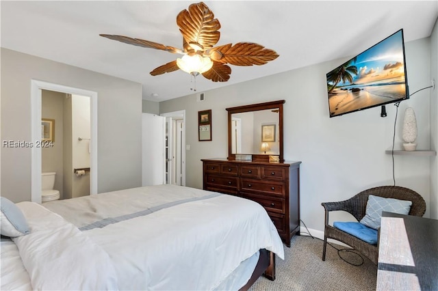 carpeted bedroom with ceiling fan and ensuite bathroom