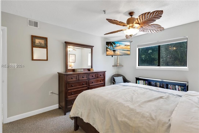 bedroom featuring light carpet and ceiling fan