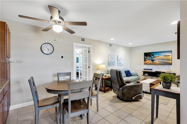 tiled dining area with ceiling fan