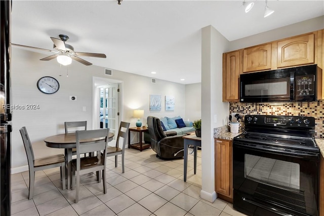 kitchen with tasteful backsplash, light stone counters, light tile patterned floors, ceiling fan, and black appliances