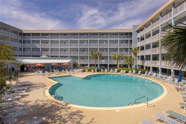 view of swimming pool featuring a patio