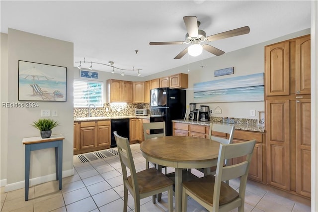 dining space with sink, ceiling fan, and light tile patterned flooring