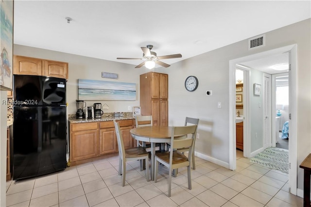 dining room with light tile patterned flooring and ceiling fan