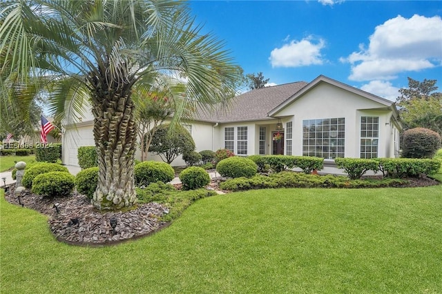 single story home with a front lawn