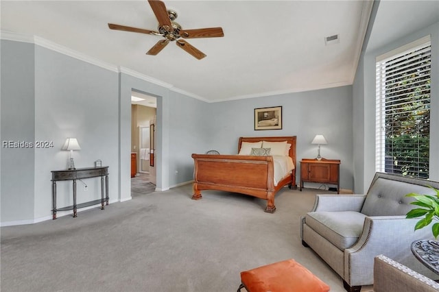 carpeted bedroom featuring ornamental molding and ceiling fan