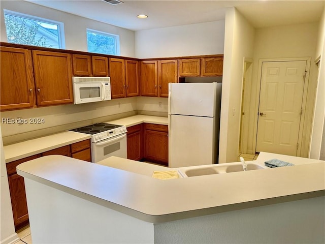 kitchen with sink and white appliances