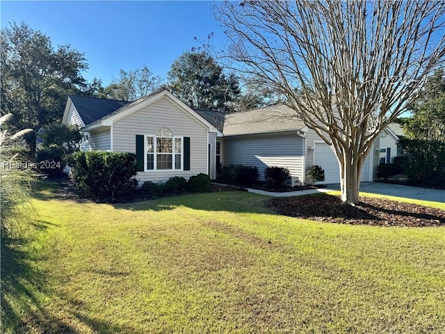 single story home with a garage and a front yard